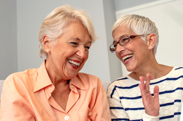Image portraying a group of seniors engaging in social activities like conversation, games, and exercise, highlighting the importance of socialization for healthy aging.